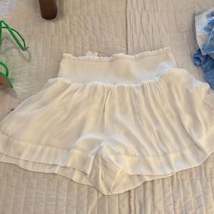 White silk high rise wide leg shorts.